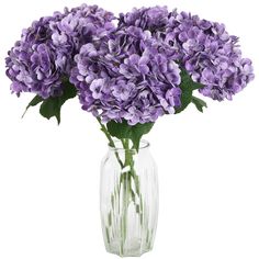 a vase filled with purple flowers on top of a table