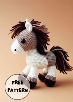 a crocheted toy horse with dreadlocks on it's head