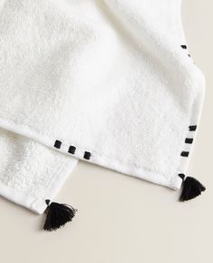 two black and white towels laying on top of each other