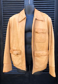 "Vintage Men's Italian Leather Coat, Luxury Leather Safari Jacket, Professor Core Jacket, Hemingway Style, Bush Jacket Sport Camel Lambskin Medium Men's Really beautiful and soft!  The camel color leather is of very high quality  Made by Murano Sport and sized a Medium Measures 27\" from middle of neck to bottom seam Pit to pit is 23\" taken flat across the back Shoulder to shoulder is 20\" Adjustable side belts Sleeve is 20\" from pit to cuff and 26\" from shoulder to cuff Some wear to cuffs, t Hemingway Style, Jacket Sport, Ostrich Boots, December 30, Safari Jacket, December 21, Hip Hop Streetwear, Knit Sleeve, Mens Luxury