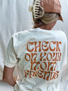 Discover the perfect way to keep the mom vibe alive and spreading positivity with our "Check On Your Mom Friends" Graphic T-shirt. Crafted with love and attention to detail, this t-shirt isn't just a piece of clothing; it's a message, a reminder to everyone to keep the sisterhood of motherhood strong and supported. Printed on a high-quality Comfort Colors t-shirt, it promises not only a meaningful message but also unbeatable comfort and durability. This Mom Graphic T-shirt, featuring a groovy fo Postpartum Clothes, Friends Graphic, Post Partum Outfits, Mom Friends, Groovy Font, Mom Outfit, New Mom Gift, Friends Mom, Positive Affirmation