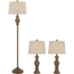 two lamps with shades on each lamp and one light on the floor, both in bronze