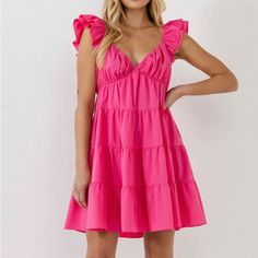 Fuchsia/ Hot Pink Color This Romantic Mini Dress From Endless Rose Can Be Styled For Both Casual And Special Occasions. The Ruffle Sleeves, Tiered Design, And Flowy Silhouette Create A Whimsical Piece. The Lining Makes This Dress Comfortable To Wear All Day, Or Night, Long, While The Side Zipper Makes Changing A Breeze. Layered Ruffle Cap Sleeves Elastic At Shoulders V-Neck Tiered Design Lined Mini Length Flowy Silhouette Concealed Side Zipper With Hook-And-Eye Closure Hand Wash Cold Do Not Blea Jumpsuit Fall, Tiered Mini Dress, Tweed Dress, Rose Dress, Heat Styling Products, Romper With Skirt, Dress Cuts, Dress First, Sweetheart Neckline