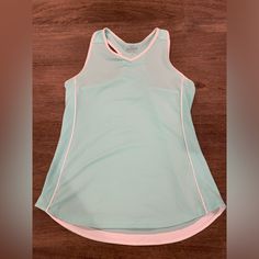 a women's tank top on a wooden surface