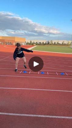 a person on a track throwing a frisbee to another person in the air