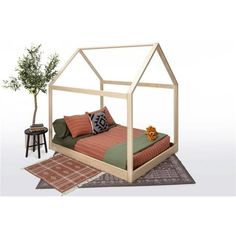 a bed sitting on top of a rug next to a table with a potted plant