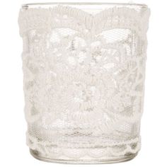 a glass vase with white lace on it