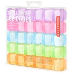 assorted pastely colored ice cubes are in a display box on a white background