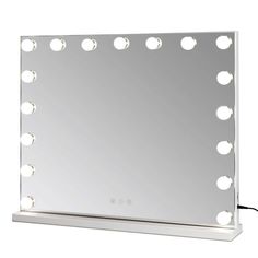 a large mirror with lights on top of it