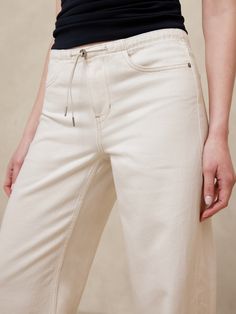 Designed with warm-weather in mind, this lightweight jean is cut in a low-rise straight silhouette.  from Italian denim—one we love for its beautiful drape and softness.  Low-Rise Straight Fit: Low rise, relaxed through the thigh with a straight leg.  Full length.  Fabric from Italy's Candiani mill.  Zip fly with hook and bar closure.  Bungee drawstring detail.  Four pocket design.  Unlined.  Low-Rise Straight Fit: Low rise, relaxed through the thigh with a straight leg.  Full length.  Inseams: Wide Leg Tencel Jeans For Summer, Beige Relaxed Fit Flare Jeans, Summer Relaxed Fit Tencel Jeans, Beige Relaxed Fit Flare Jeans For Spring, Beige Denim Flare Jeans For Spring, Cream Relaxed Fit Denim Jeans, Cream Denim Jeans Relaxed Fit, Casual Beige Flare Jeans For Summer, Cream Straight Leg Jeans For Spring