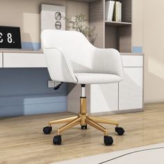 a white office chair sitting on top of a hard wood floor next to a desk