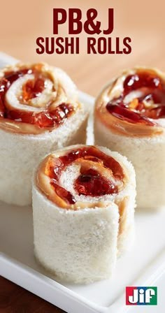 three sushi rolls on a plate with ketchup