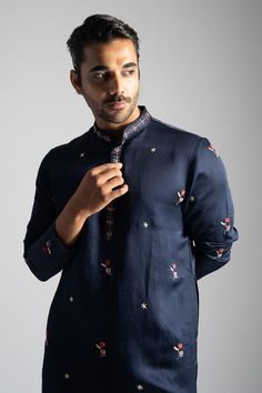 Navy blue kurta featuring multicolour thread embroidered tulip and floral motifs. Comes with pant. - Aza Fashions Designer Floral Embroidered Kurta For Diwali, Designer Traditional Wear With Floral Embroidery For Diwali, Designer Embroidered Cotton Traditional Wear, Blue Embroidered Cotton Silk Kurta, Indigo Kurta With Floral Embroidery For Eid, Indigo Floral Embroidered Kurta For Eid, Indigo Kurta With Floral Embroidery And Long Sleeves, Designer Embroidered Indigo Kurta, Designer Blue Kurta With Intricate Embroidery