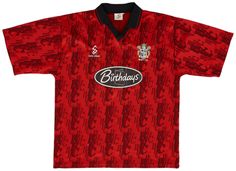 an old liverpool football shirt with the crest on it