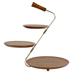 three tiered shelf with two wooden plates on each side and a metal handle, in the shape of a lamp