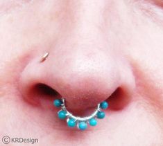 The one you see in the picture is a 18Ga, 8mm, non-pierced septum ring, with 2mm ball ends and 2mm Arizona Turquoise wrapped with silver. Very comfortable to wear and you can use it for your ears as well. I could also make it with other stones or crystals and if you sensitive to silver, in 14K white gold.Also, if you need it for a real septum ring, just leave me a note at your checkout~~Thank you for stopping by & supporting handmed! Have a blessed day~~KR  :) Unique Pierced Septum Ring As Gift, Unique Nickel-free Septum Ring As Gift, Unique Septum Ring As Gift, Nickel-free Spiritual Septum Ring As Gift, Spiritual Nickel-free Septum Ring Gift, Unique Adjustable Septum Ring, Nickel Free, Unique Handmade Septum Ring For Gift, Unique Handmade Septum Ring As Gift, Silver Septum Ring