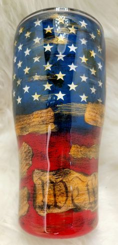 an american flag vase sitting on top of a white furnishing area with stars and stripes