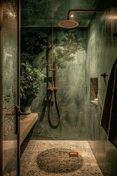 a bathroom with green walls and tile flooring, shower head in the corner next to sink