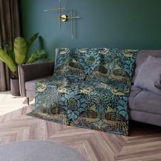 a living room filled with furniture and green walls