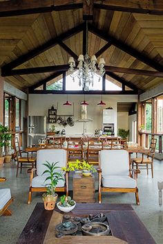 a living room filled with furniture and lots of windows