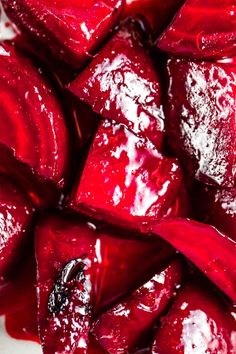 sliced up beets sitting on top of a white plate covered in powdered sugar