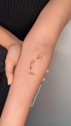 a woman with a tattoo on her arm