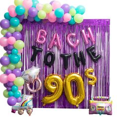 balloons and streamers are arranged in the shape of a sign that says back to the 90's