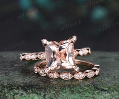 an engagement ring set with a pink morganite surrounded by white topaz and diamonds