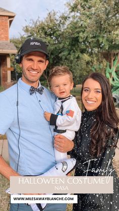 a man and woman holding a baby in front of a house with the caption halloween costume