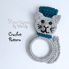 there is a crochet cat ring on the wall