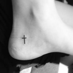 small cross tattoo on foot really want this