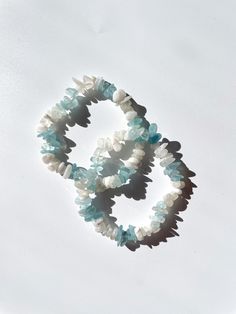 "Please read before ordering: Listing is for one (1) Aquamarine and Moonstone combo crystal chip bracelet. Size: 7.5\" - for custom size, please leave in notes prior to check out. Aquamarine: Stone of courage, communication and trust. Moonstone: Intuition, feminine energy, spiritual guidance. Please note, due to the uniqueness of each crystal listing photo is used as a reference only. Each bracelet may vary. Follow us on instagram for more updates! @shoplamansi <3" Crystal Chip Bracelets, Chip Bracelet, White Beaded Bracelets With Stones For Gift, Celestite Crystal, Couples Bracelet, Carnelian Ring, Moonstone Crystal, Crystal Shapes, Natural Sunlight