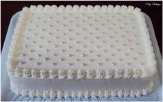 a square cake with white frosting on top