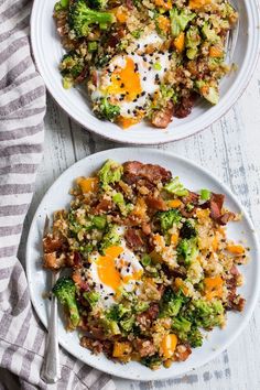 two white plates filled with food on top of a table