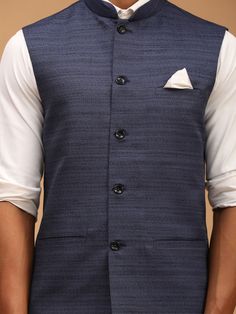 VASTRAMAY Navy Blue Cotton Blend Solid Nehru Jacket A stylish and versatile addition to your wardrobe, the VASTRAMAY Navy Blue Nehru Jacket is crafted from premium cotton blend fabric for comfort and durability. Key Features: Solid navy blue color Nehru collar design Cotton blend fabric Button closure Two side pockets Specifications: Color: Navy Blue Material: Cotton Blend Sizes Available: S, M, L, XL Material & Care: Machine wash cold, gentle cycle. Do not bleach. Tumble dry low. Warm iron if n Nehru Jacket, Nehru Jackets, Cotton Blend Fabric, Collar Designs, Navy Blue Color, Bleach, Cotton Blend, Navy Blue, Blue Color