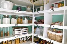 an organized pantry with lots of food and containers on the shelves, including cereals