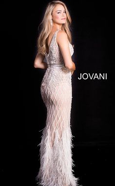 Ivory Embellished V Neck Fitted Jovani Dress 55796 Style Code: 55796 Available Colors: black, ivory, light-blue Colors: Available Sizes: 00 - 24 Closure: Invisible Back Zipper with Hook and Eye Closure. Details: Embellished mesh dress, fully lined, floor length skirt, high slit, feather at bottom of the skirt, embellished belt, sleeveless bodice, plunging neckline with sheer mesh insert, v back, straps over shoulders. Embellished Prom Dress, Ivory Prom Dresses, Feather Prom Dress, Jovani Dress, Fitted Gowns, Jovani Prom, Feather Skirt, Jr Prom, Embellished Belt