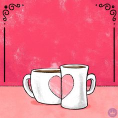 two coffee mugs with hearts on them sitting side by side in front of a pink wall