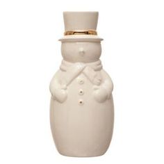 a white ceramic snowman bottle with a gold top hat on it's head