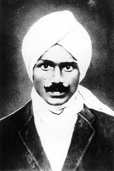 an old black and white photo of a man with a turban