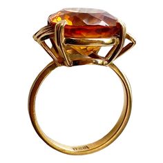 This classic 18K gold ring masterfully displays a magnificent Imperial Citrine quartz crafted in the shape of a large 06.2" x 0.5" x 0.3", weighing 6.5 grams. Size 6, ring size 1" h by 0.75" w by 0.50 " d The stone is set in a center prong style for eye-catching brilliance. This exquisite piece of jewelry is an ideal addition to any fine jewelry collection and provides excellent style and luxury. Citrine is more than just a beautiful gemstone; it carries a wealth of symbolism and cultural signif Luxury Faceted Amethyst Ring For Formal Occasions, Luxury Faceted Amethyst Ring For Formal Events, Luxury Hallmarked Topaz Ring For Formal Occasions, Formal Yellow Gold Rings With High Luster, High Luster Yellow Gold Rings For Formal Occasions, Luxury High Luster Gemstones For Formal Occasions, Formal High Luster Yellow Gold Rings, Gold Crystal Ring With Polished Finish For Formal Occasions, Elegant Formal Citrine Gemstones