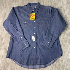 Vintage 80s Wrangler Two Pocket Pearl Snap Cowboy Western Dress Formal Blue Button Up Long Sleeve Shirt Double Extra Large Mens *Y12 Condition:  Excellent Used Condition  = No Flaws Measurements: Please see photos above for all measurements IF YOU BUY TWO OR MORE ITEMS USE THE CODE BUNDLE @ CHECK TO SAVE 20% WE SHIP WITHIN 24 HOURS AFTER PURCHASE! Please be aware that we do not offer free returns!! The Buyer is responsible for the cost of the return label.  Follow us on TikTok & Instagram @findsnostalgic and tag us in your finds Dark Wash Long Sleeve Shirt For Rodeo, Blue Western Shirt With Button Closure, Blue Shirt With Pockets For Rodeo, Blue Tops With Pockets For Ranch, Western Dress, Button Up Long Sleeve, Cowboy Western, Dress Formal, Mens Oxfords