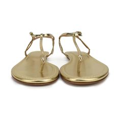 Aquazzura thong sandals in gold metallic leather with curved detail and buckle closure in gold hardware. Please note that shoes are different sizes, see details below. Includes dust bag. Brand = Aquazzura Condition = 10/10, Brand new without box Size = Right shoe: 35.5 EU, Left shoe: 36 EU Material = Leather Hardware = Gold SKU = 22806-7 Luxury Gold T-strap Sandals For Summer, Chic Gold Sandals With Gold-tone Hardware, Gold Open Toe Luxury T-strap Sandals, Gold Sandals With Gold-tone Hardware, Gold Luxury Open Toe T-strap Sandals, Luxury Gold T-strap Sandals With Open Toe, Gold Sandals With Gold-tone Hardware For Party, Gold Leather T-strap Sandals For Party, Gold Sandals With Open Heel And Gold-tone Hardware