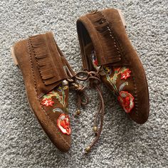 Suede Moccasins With Ankle Fringe And Ties, Intricate Floral Embroidery, New Without Box Condition Bohemian Slip-on Moccasins For Fall, Miller Sandals Tory Burch, Fringe Moccasins, Beaded Moccasins, Tory Burch Ballet Flats, Nude Wedges, Miller Sandal, Fringe Booties, Suede Moccasins