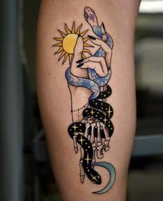 a woman's leg with a tattoo on it and the sun above her arm