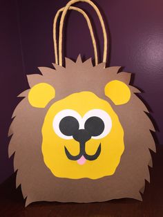 a paper bag with a lion face on it