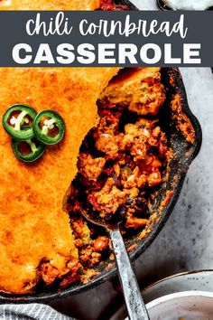 a skillet filled with chili cornbread casserole and topped with jalapenos