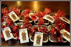 there are many small trays filled with candies and candy canes on the table