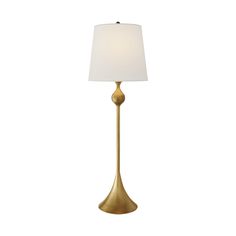 a gold lamp with a white shade on it