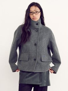 This coat with cropped length features a refreshing cropped length and a signature cocoon fit silhouette, perfect for exuding a casual yet feminine vibe.- Made of premium cashmere processed wool material- High-neck stand collar to add appeal to the item- Pocket details with blue embroidery Grey Coat, Blue Embroidery, Short Coat, Pocket Detail, Stand Collar, High Neck, Cashmere, Jackets & Coats, Embroidery